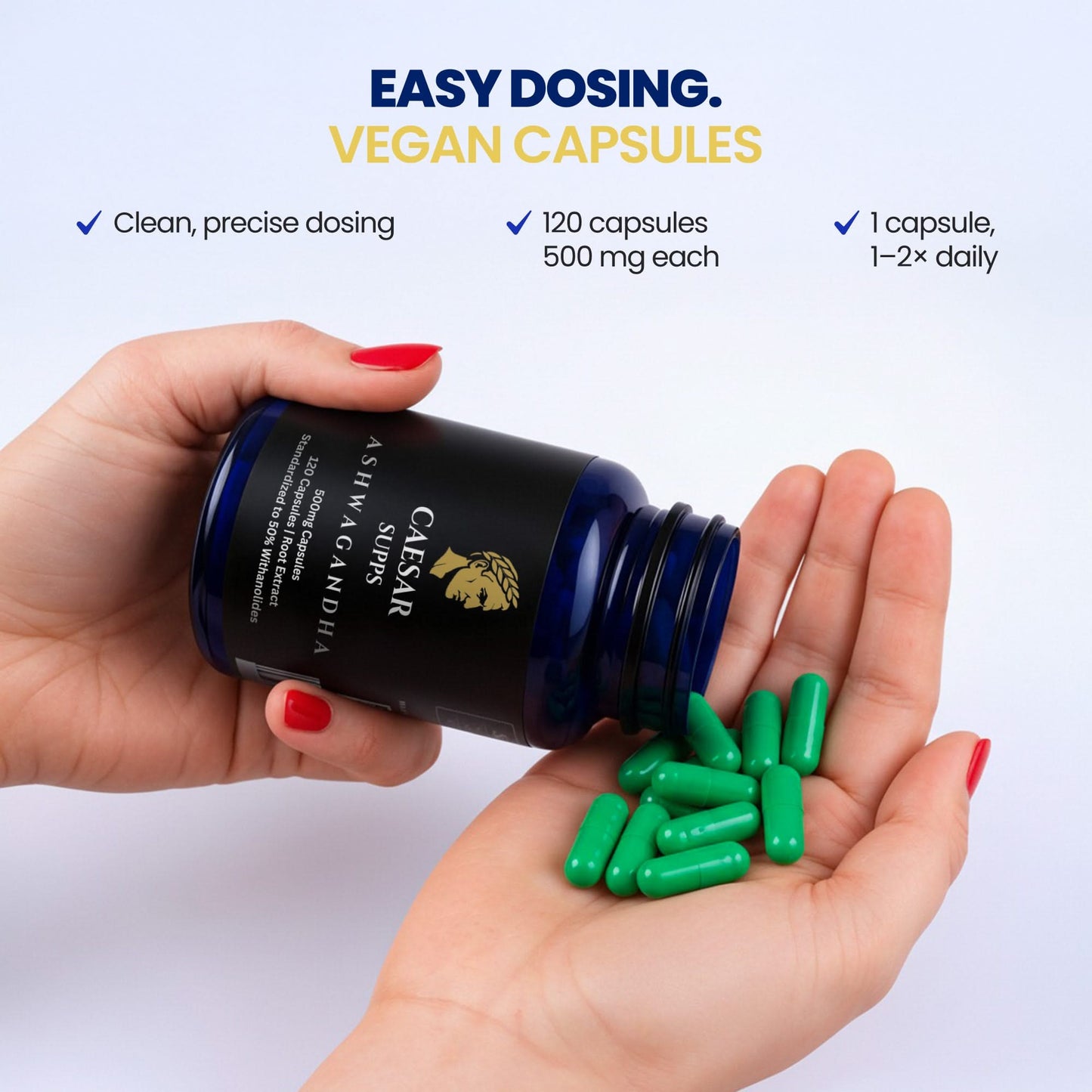 Hand holding a bottle of Caesar Supps vegan capsules with green capsules spilling out on a white background.